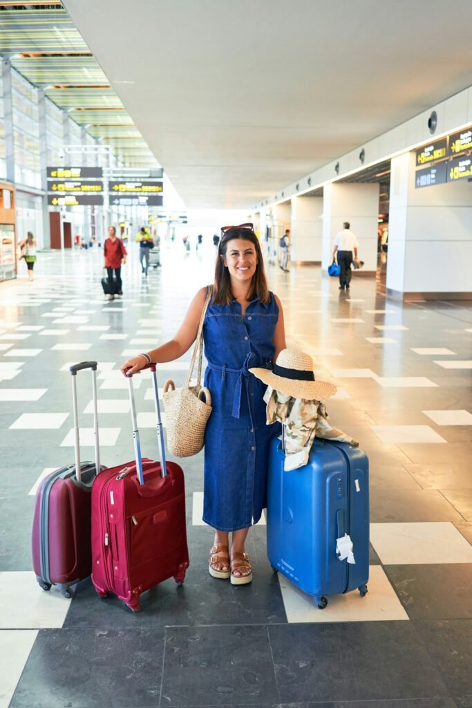 Traveller with suitcases in an airport terminal