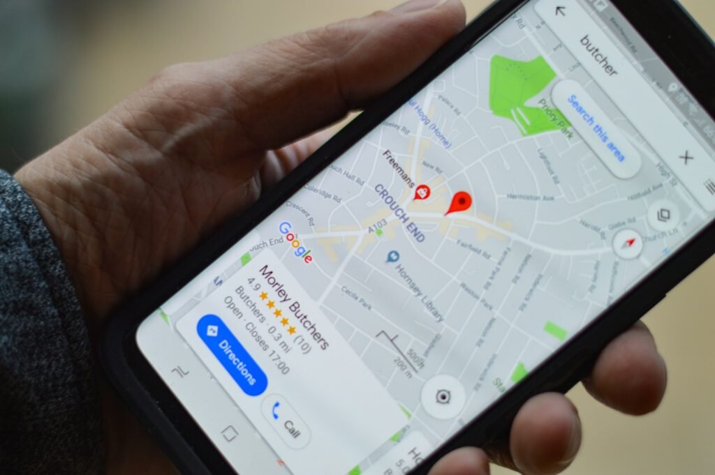 Hand holding a phone showing a map